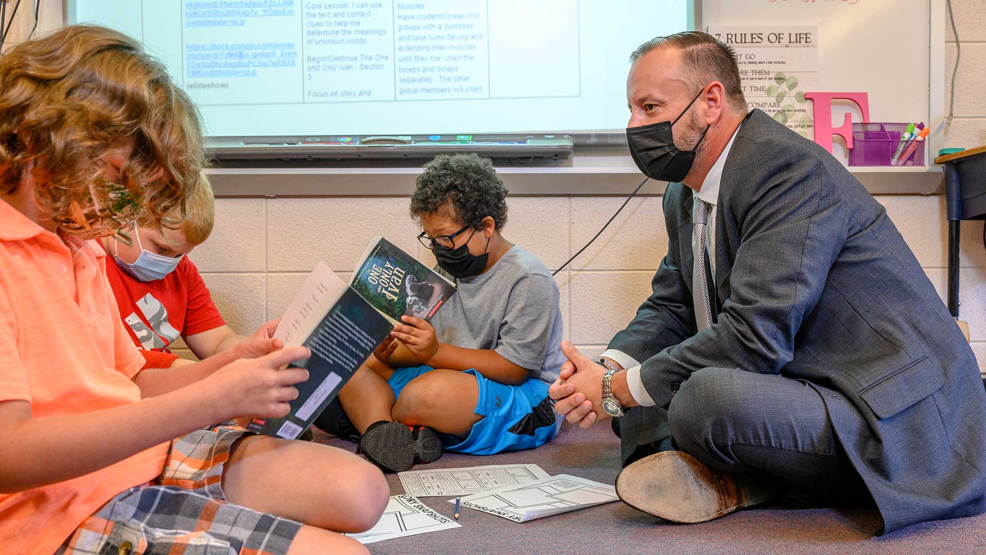 Photo of Aaron Woody with students