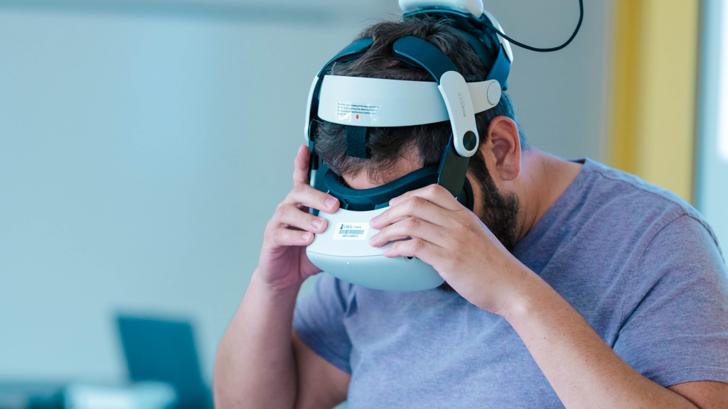 A man uses a virtual reality headset.