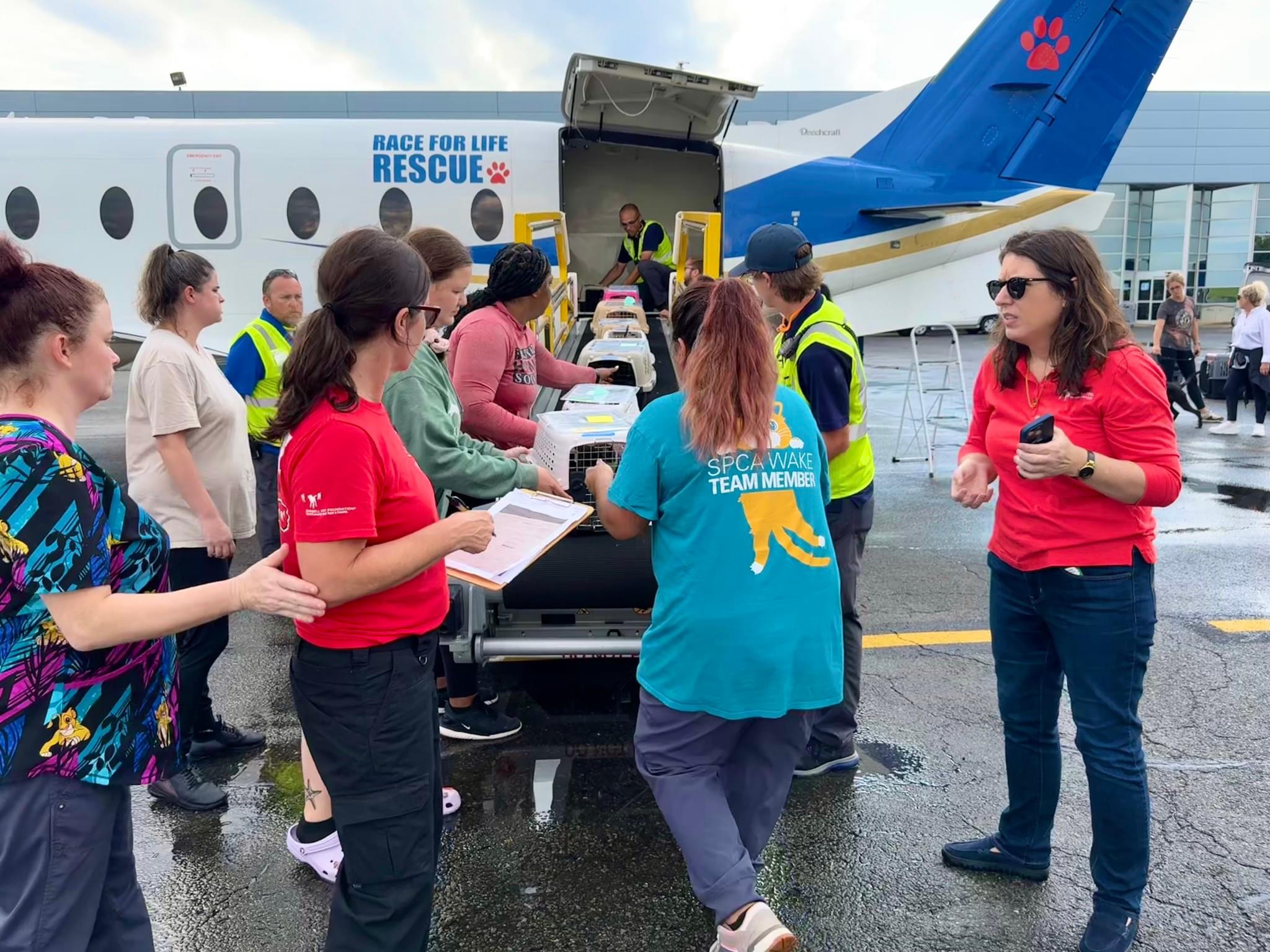 Jessica Arias, far right, as pets transported to safety